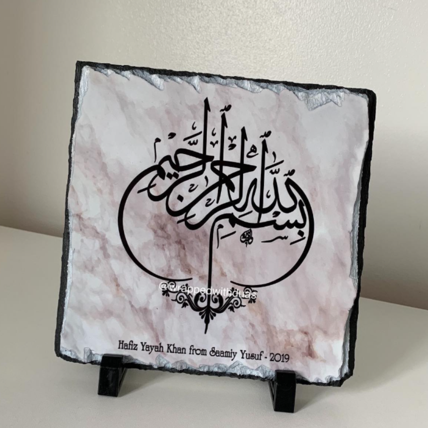 Personalised Bismillah rock slate with Arabic calligraphy on pink marble background, personalised with name and date