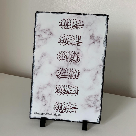 Islamic dhikr rock slate featuring 6 kalimas in Arabic calligraphy on white marble background with mini stands