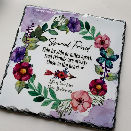 A square slate with a custom floral design, featuring the text 'Special Friend' surrounded by watercolor flowers, green leaves, and butterflies on a white background.